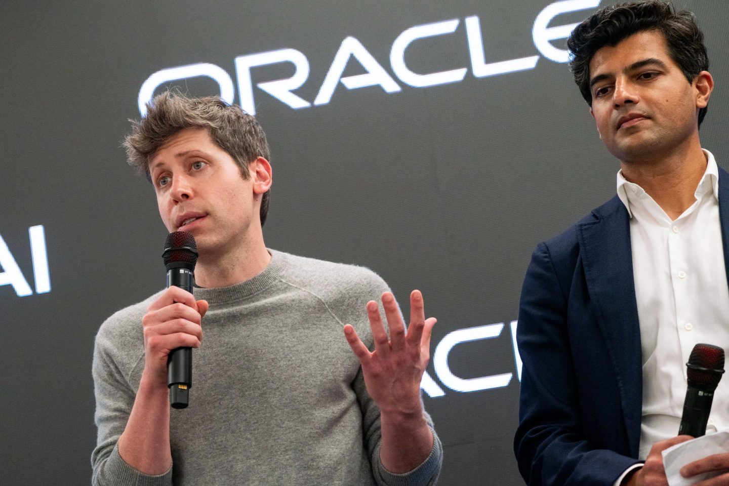 Sam Altman speaking into a mic.