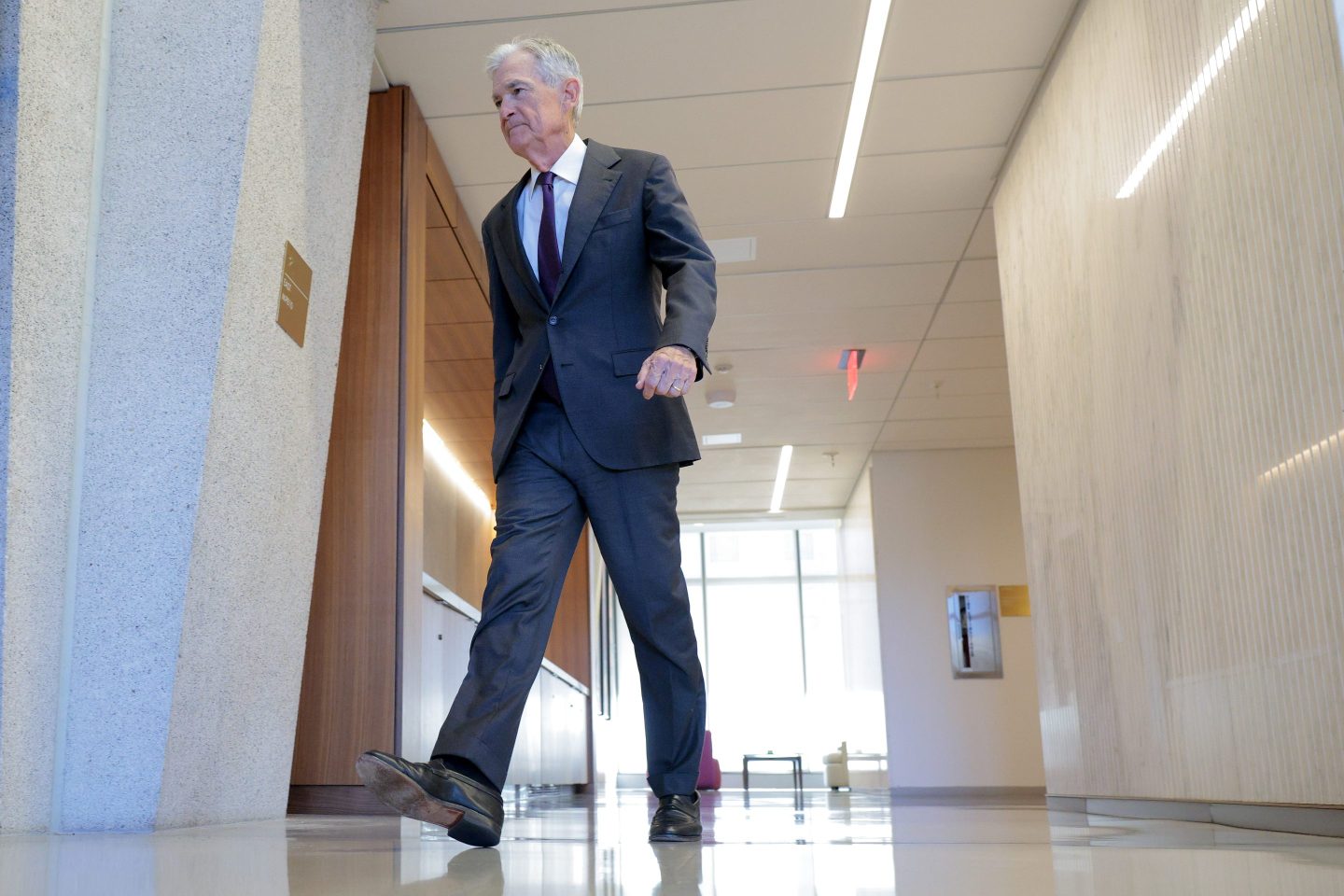 Federal Reserve Chairman Jerome Powell walks between meetings at the Fed on January 13, 2026 in Washington, DC.
